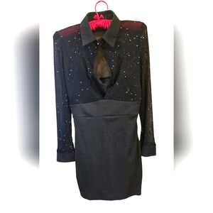 Little black dress with glitter highlights on the top. Size Medium.